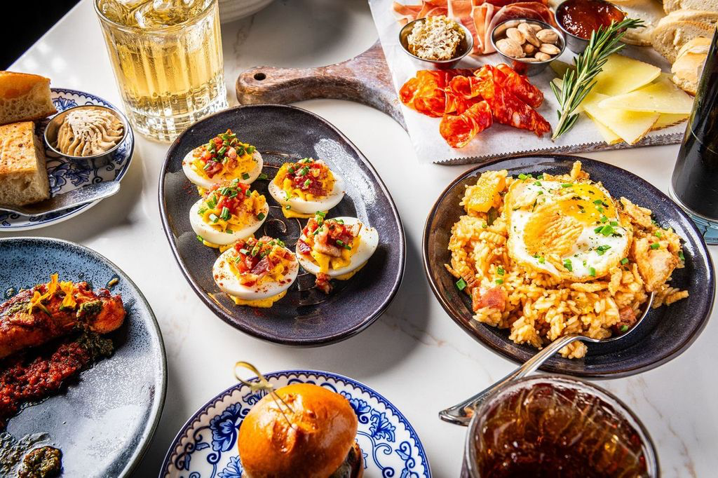 A table spread with samples of our small bites, seafood, steaks, and seasonal items